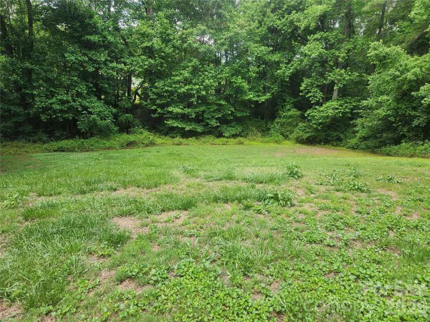 135 Watson Avenue, Taylorsville, NC 28681.  MLS# CAR4385502, YatesRealty ID 25516. Back yard