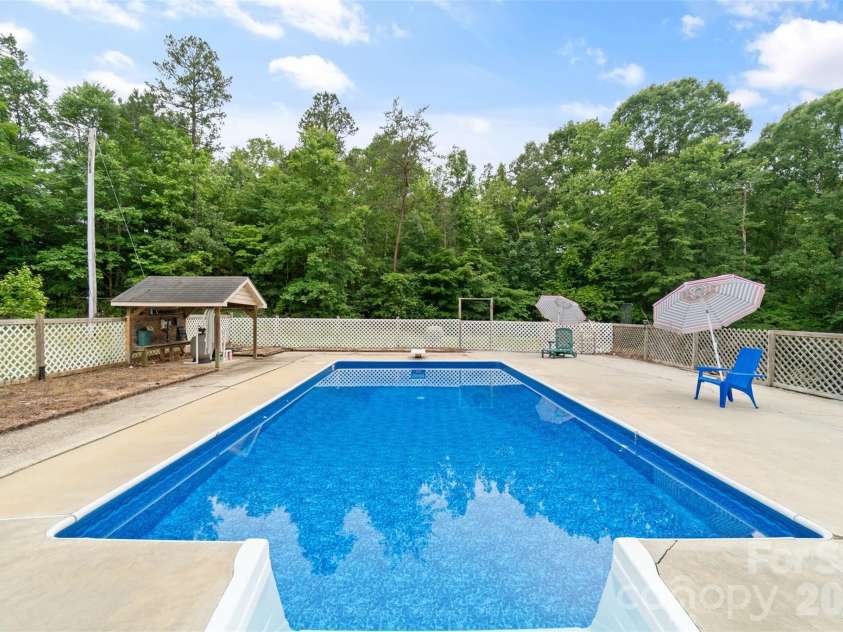 229 Oakridge Road, Stanley, NC 28164.  MLS# CAR4386671, YatesRealty ID 25518. Pool and pool area