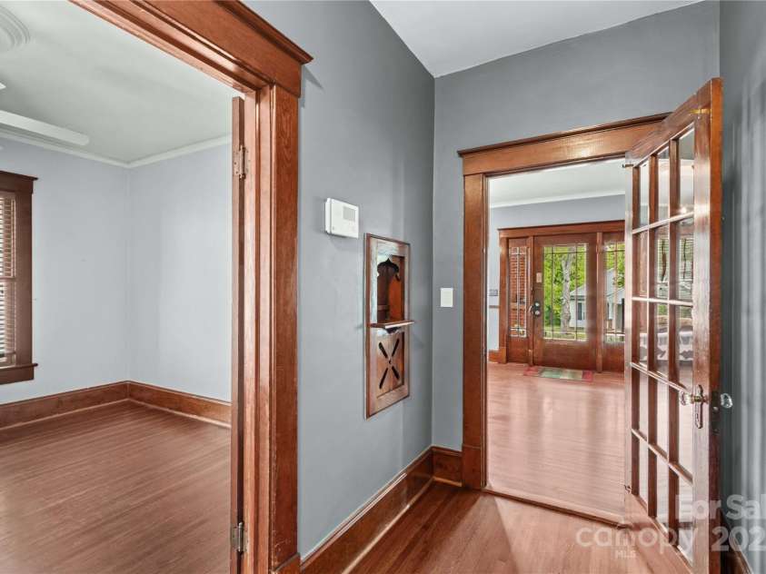 119 Wiley Avenue, Salisbury, NC 28144.  MLS# CAR4250756, YatesRealty ID 25522. Hallway with phone niche, front door and first bedroom