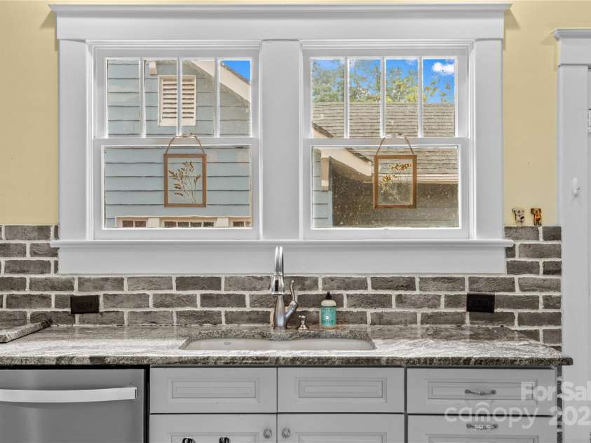 119 Wiley Avenue, Salisbury, NC 28144.  MLS# CAR4250756, YatesRealty ID 25522. Kitchen sink view with custom brick backsplash