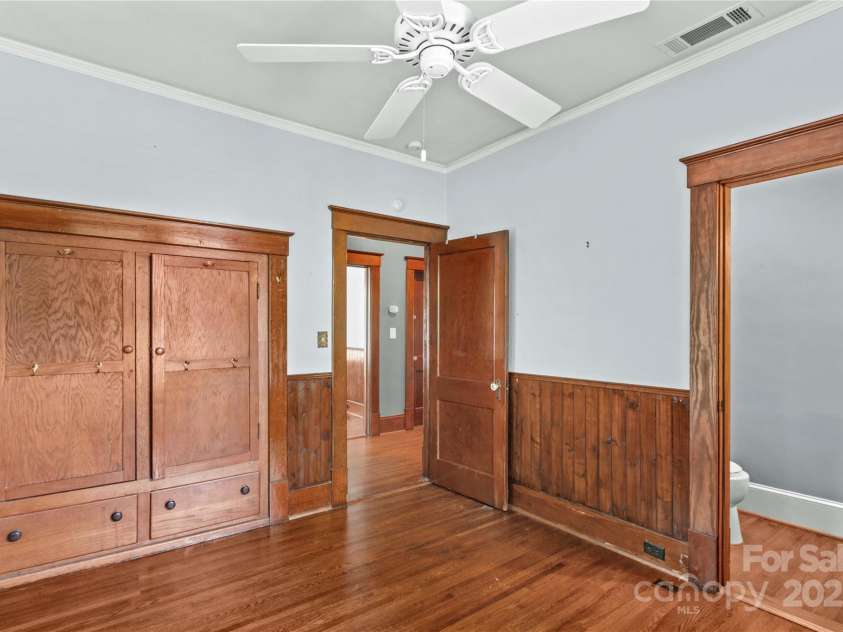 119 Wiley Avenue, Salisbury, NC 28144.  MLS# CAR4250756, YatesRealty ID 25522. Primary bedroom with built in armoire and 1/2 bath