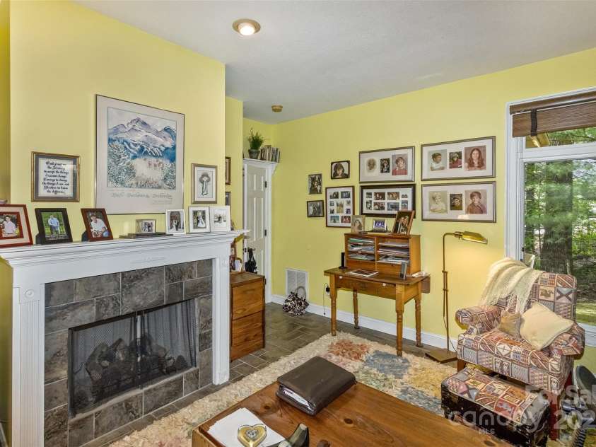 25 Windsong Drive, Fairview, NC 28730.  MLS# CAR4261079, YatesRealty ID 25523. Cozy Den, Currently Office, with Gas Fireplace.