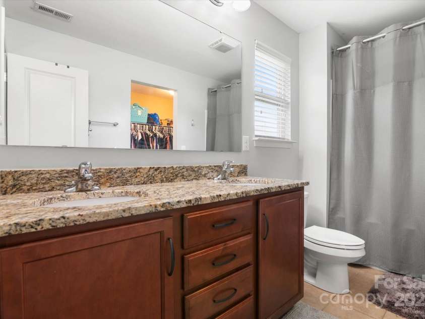 1628 Fitchburg Court, Charlotte, NC 28214.  MLS# CAR4276225, YatesRealty ID 25525. Counter height dual vanity!