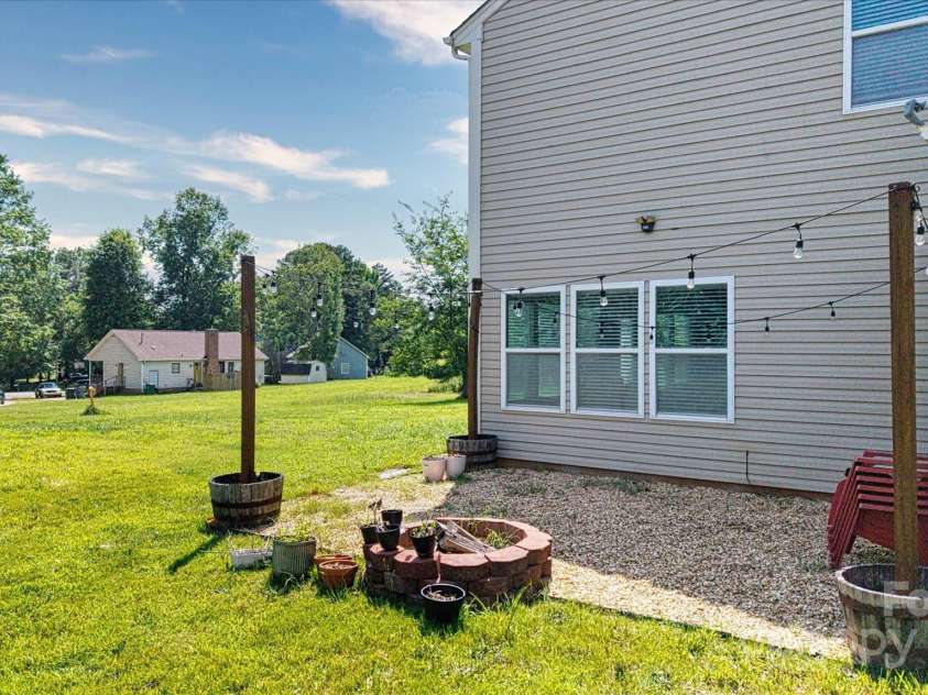 1628 Fitchburg Court, Charlotte, NC 28214.  MLS# CAR4276225, YatesRealty ID 25525. Entertainment area with a firepit for your enjoyment at night to watch the stars!