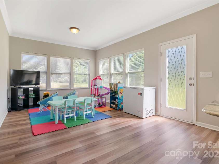 1628 Fitchburg Court, Charlotte, NC 28214.  MLS# CAR4276225, YatesRealty ID 25525. Flex space/Sunroom with Windows! Natural Light At It's Best!