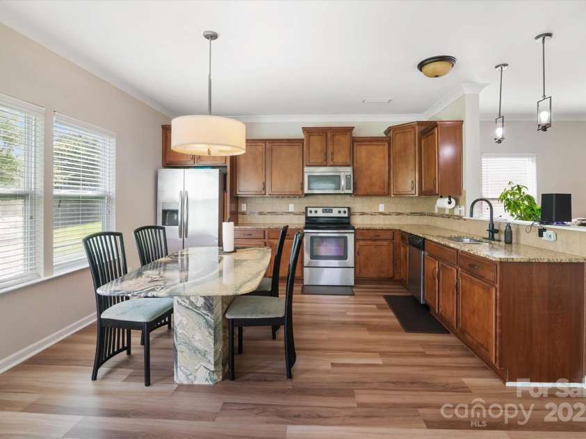 1628 Fitchburg Court, Charlotte, NC 28214.  MLS# CAR4276225, YatesRealty ID 25525. Large kitchen allows for full size kitchen table