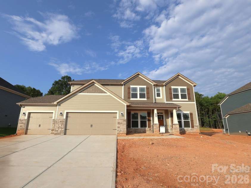233 Amber Glen Drive, Locust, NC 28097.  MLS# CAR4384629, YatesRealty ID 25526. Exterior. Sod will be installed once home is sold