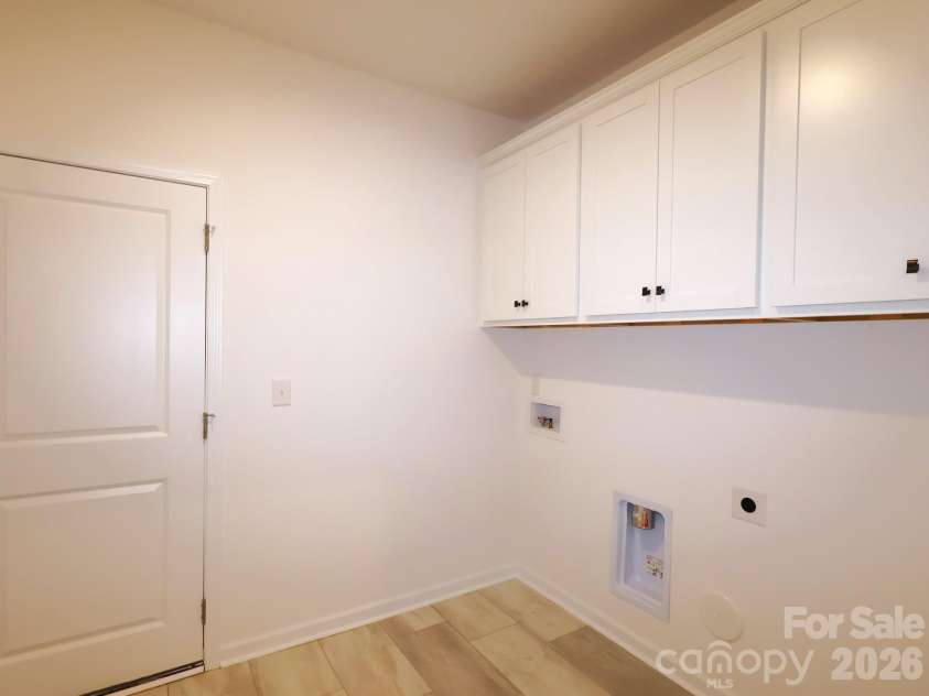 233 Amber Glen Drive, Locust, NC 28097.  MLS# CAR4384629, YatesRealty ID 25526. Laundry room