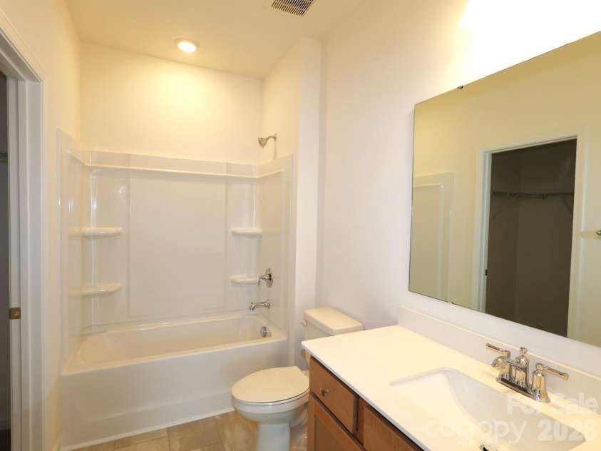 233 Amber Glen Drive, Locust, NC 28097.  MLS# CAR4384629, YatesRealty ID 25526. Secondary bathroom