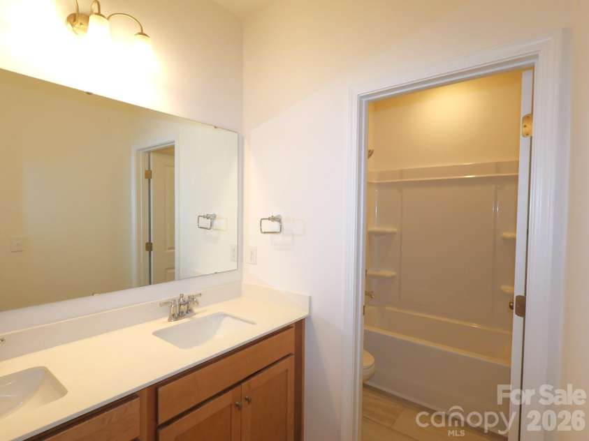233 Amber Glen Drive, Locust, NC 28097.  MLS# CAR4384629, YatesRealty ID 25526. Secondary bathroom