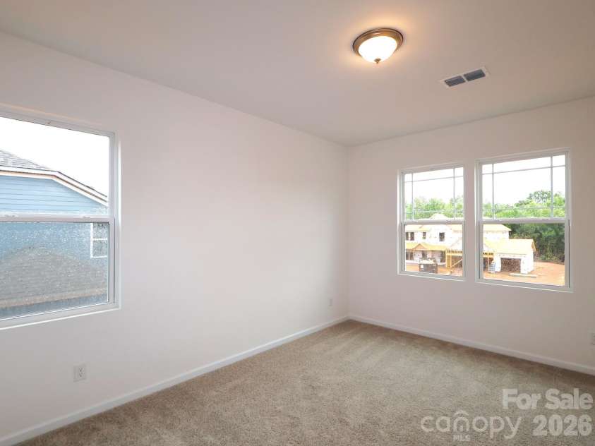 233 Amber Glen Drive, Locust, NC 28097.  MLS# CAR4384629, YatesRealty ID 25526. Secondary bedroom
