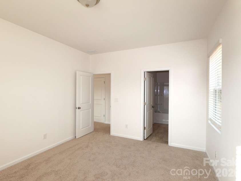 233 Amber Glen Drive, Locust, NC 28097.  MLS# CAR4384629, YatesRealty ID 25526. Secondary bedroom