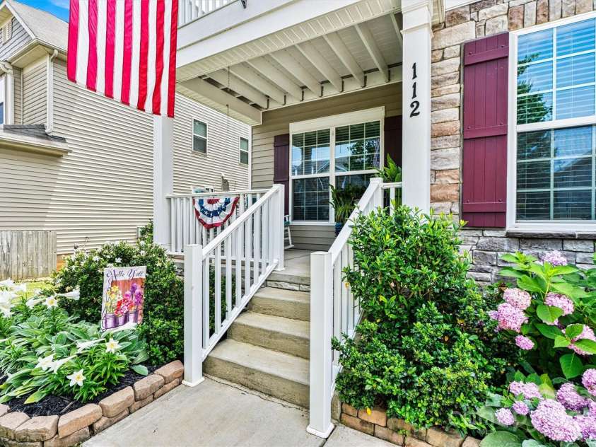 112 Heart Pine Lane, Statesville, NC 28677.  MLS# CAR4271076, YatesRealty ID 25527. The beautifully upgraded landscaping and custom curbing around the flower beds add a polished, welcoming touch.