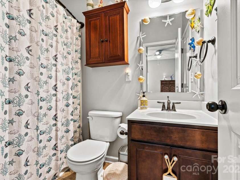 112 Heart Pine Lane, Statesville, NC 28677.  MLS# CAR4271076, YatesRealty ID 25527. The ensuite bath is thoughtfully designed with hallway access—ideal for guests during gatherings.