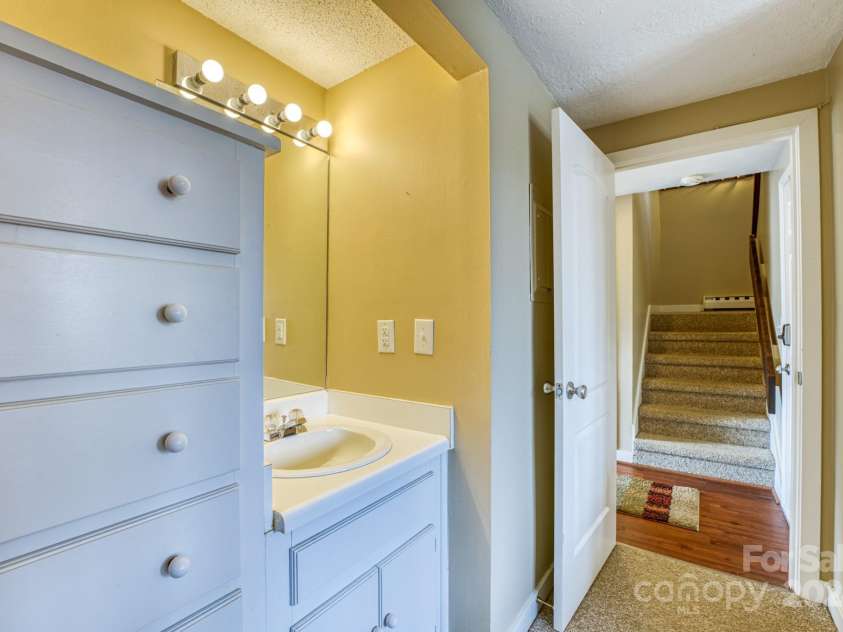 1443 Sugar Mountain Drive, Sugar Mountain, NC 28604.  MLS# CAR4122060, YatesRealty ID 2553. Bunkroom with sink and built in dresser on main floor