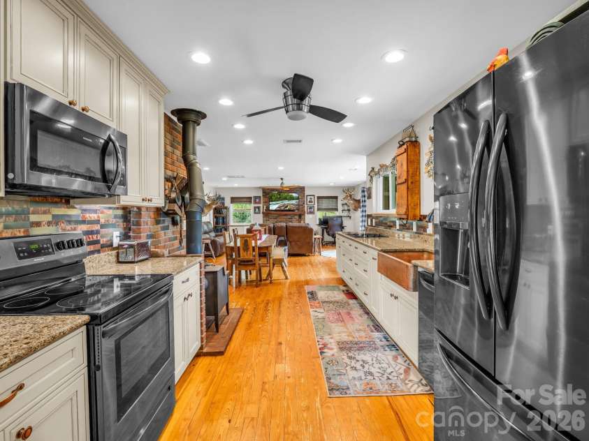 360 Shadow Lane, Green Mountain, NC 28740.  MLS# CAR4381079, YatesRealty ID 25534. Kitchen looking into living room