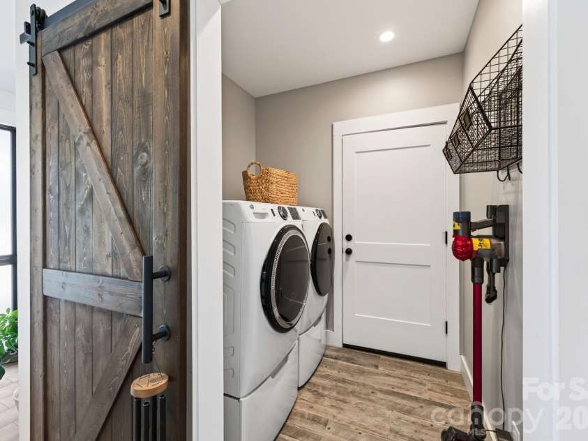 40 Malvern Walk, Asheville, NC 28806.  MLS# CAR4419917, YatesRealty ID 25535. Laundry Room with Sliding Barn Door and Garage Access