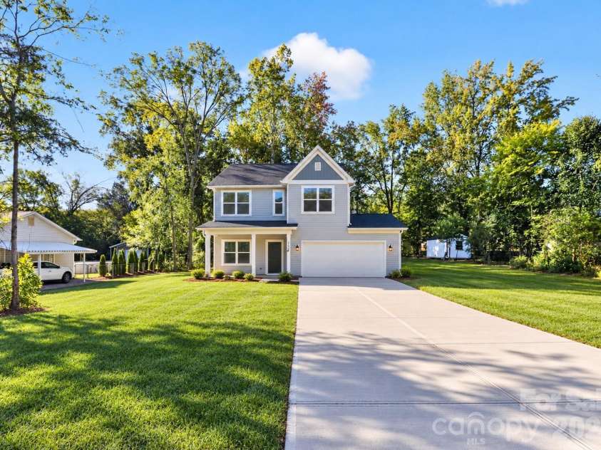 304 Woodside Drive, Harrisburg, NC 28075.  MLS# CAR4350580, YatesRealty ID 25542. AI lawn
