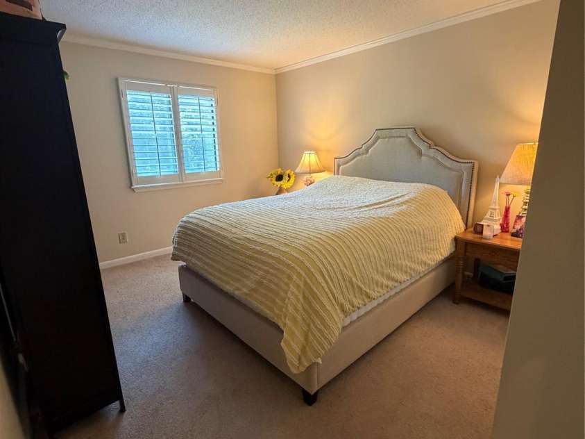 3100 Heathstead Place, Charlotte, NC 28210.  MLS# CAR4382237, YatesRealty ID 25547. Secondary Bedroom is spacious and window has Plantation Shutter. Large Closet.  Room for all your furniture with space to spare.