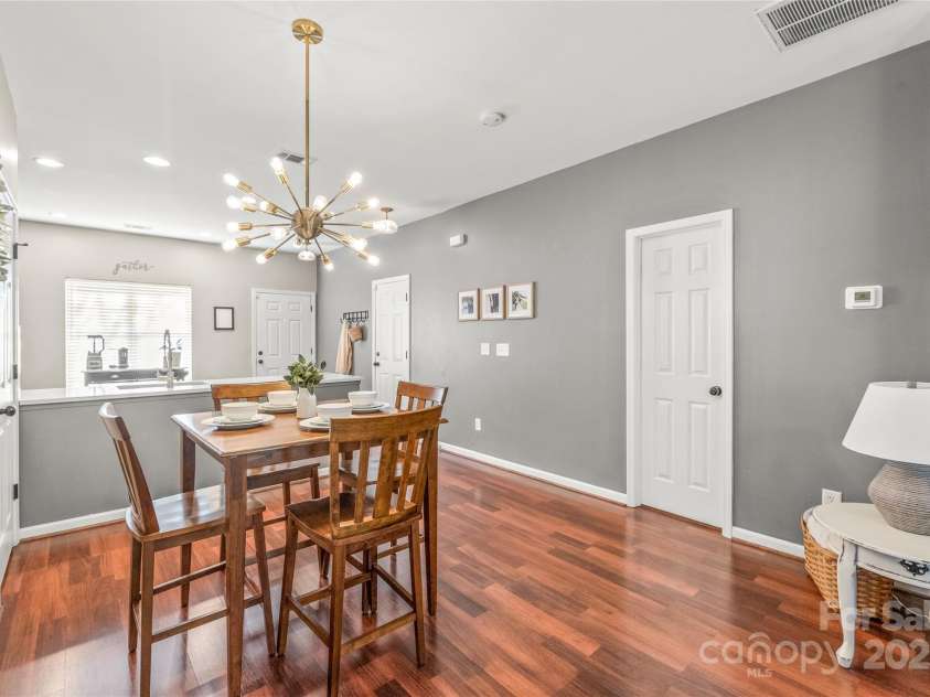 114 Clydesdale Court, Matthews, NC 28104.  MLS# CAR4234456, YatesRealty ID 2555. A full bathroom (right wall) and a walk-in storage closet (left wall) off the dining area provide both functionality and added storage space.