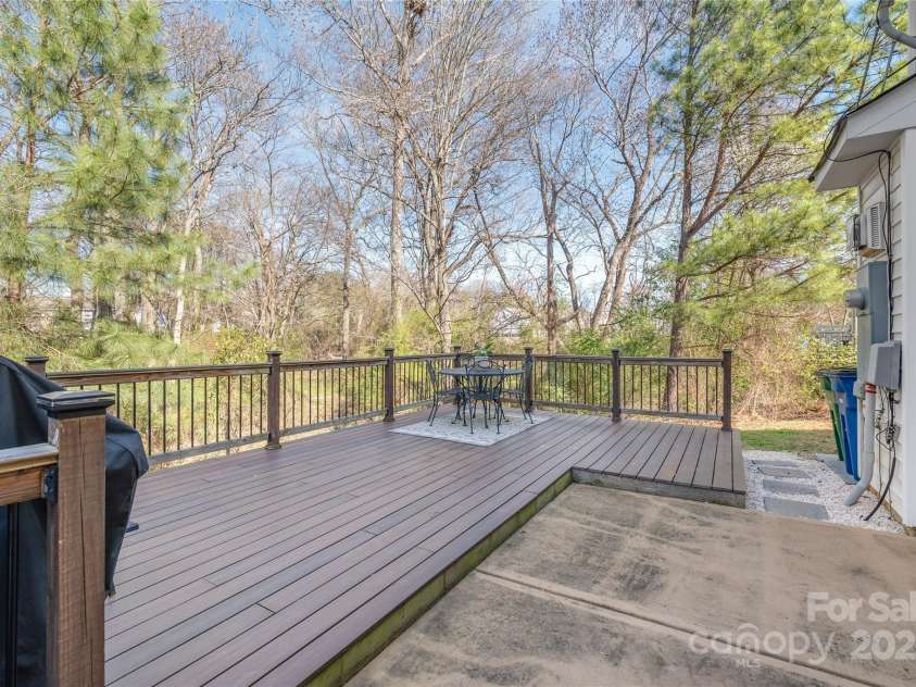 114 Clydesdale Court, Matthews, NC 28104.  MLS# CAR4234456, YatesRealty ID 2555. Enjoy the tranquility of your own private retreat on the back deck, overlooking lush trees — perfect for morning coffee or evening relaxation.