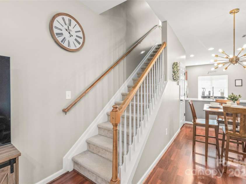 114 Clydesdale Court, Matthews, NC 28104.  MLS# CAR4234456, YatesRealty ID 2555. Head upstairs to a spacious second living area, perfect for relaxing, entertaining, or creating your own private retreat!