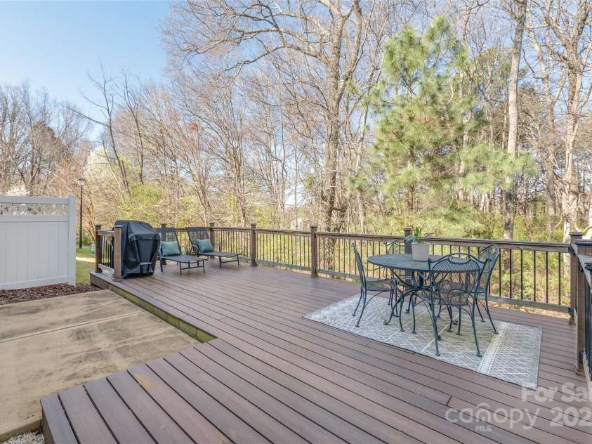 114 Clydesdale Court, Matthews, NC 28104.  MLS# CAR4234456, YatesRealty ID 2555. Host unforgettable gatherings on the spacious back deck, offering plenty of room for dining, relaxing, and enjoying the outdoors with friends and family!