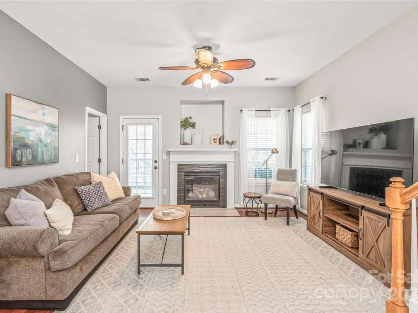 114 Clydesdale Court, Matthews, NC 28104.  MLS# CAR4234456, YatesRealty ID 2555. Relax and unwind in the spacious living room, featuring a beautiful fireplace that adds both warmth and charm to your home!