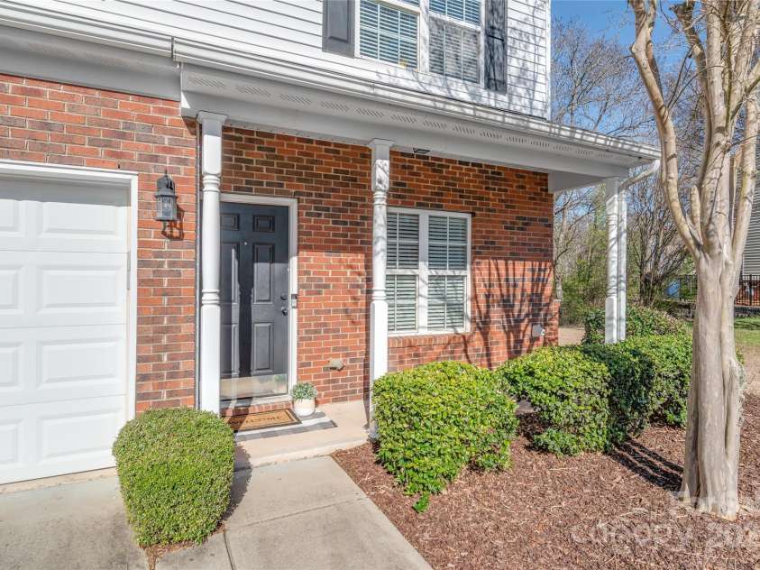 114 Clydesdale Court, Matthews, NC 28104.  MLS# CAR4234456, YatesRealty ID 2555. Relax and unwind on your inviting covered front porch — the perfect spot to enjoy your morning coffee.