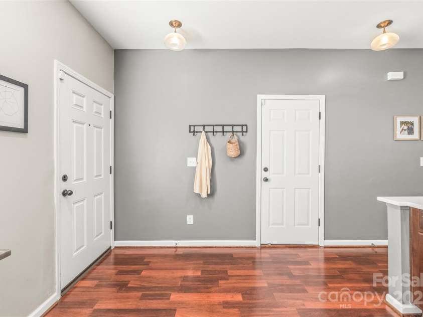 114 Clydesdale Court, Matthews, NC 28104.  MLS# CAR4234456, YatesRealty ID 2555. Step into the bright, open entryway and enjoy the beautiful luxury vinyl plank flooring that runs throughout the first floor.
