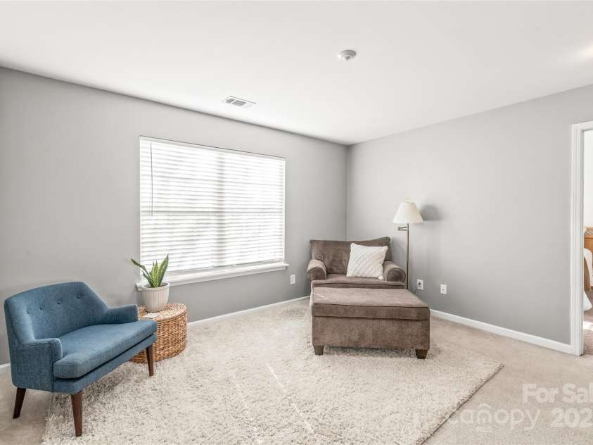 114 Clydesdale Court, Matthews, NC 28104.  MLS# CAR4234456, YatesRealty ID 2555. The second living area upstairs offers endless possibilities — whether for a cozy lounge or playroom.