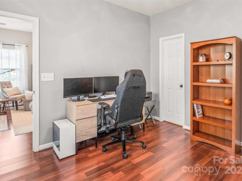 114 Clydesdale Court, Matthews, NC 28104.  MLS# CAR4234456, YatesRealty ID 2555. This spacious main-floor bedroom overlooks the peaceful, wooded backyard.