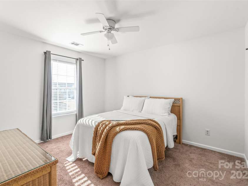 114 Clydesdale Court, Matthews, NC 28104.  MLS# CAR4234456, YatesRealty ID 2555. Whether it's a guest room or cozy retreat, bedroom 3 offers plenty of space and flexibility to suit your needs!