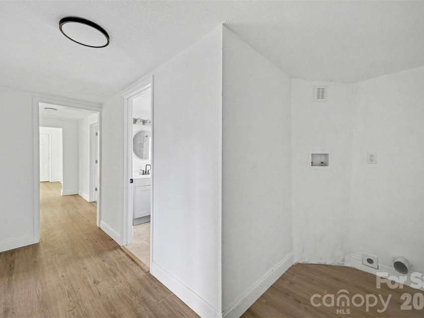 612 E Street, Newton, NC 28658.  MLS# CAR4334894, YatesRealty ID 2555. Hallway with laundry area 