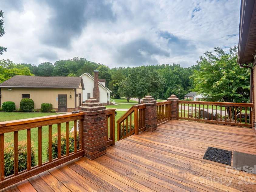 614 Azalea Lane, China Grove, NC 28023.  MLS# CAR4280599, YatesRealty ID 25550. Deck view overlooking yard and detached garage.