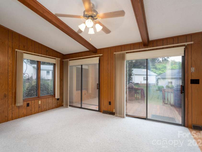 614 Azalea Lane, China Grove, NC 28023.  MLS# CAR4280599, YatesRealty ID 25550. Doors to back deck. Kitchen and breakfast area to the right.