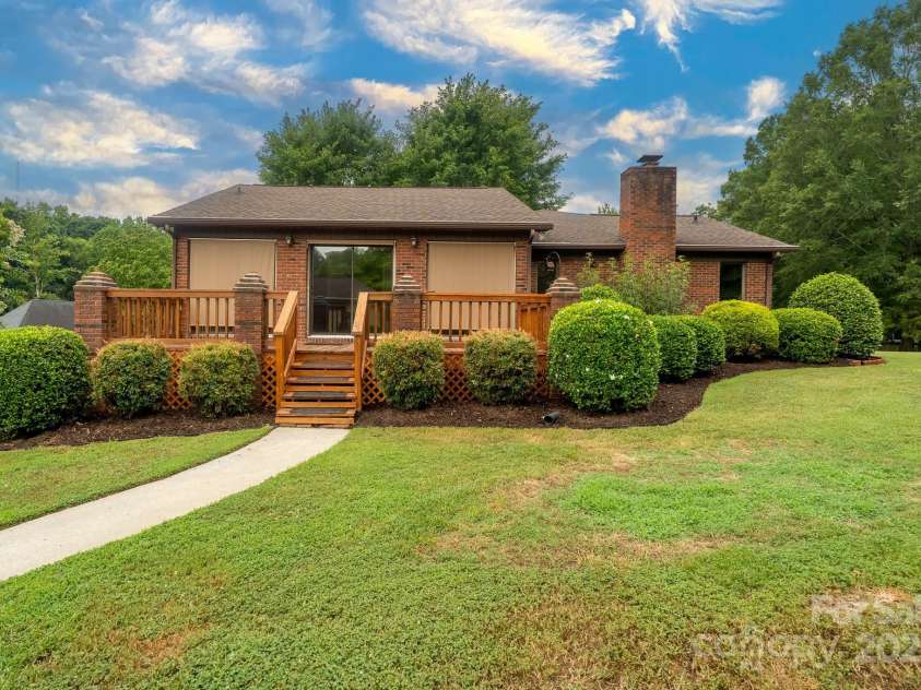 614 Azalea Lane, China Grove, NC 28023.  MLS# CAR4280599, YatesRealty ID 25550. Ground level view of back yard and rear deck.