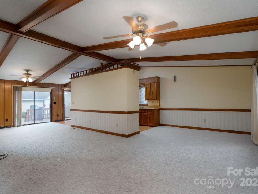 614 Azalea Lane, China Grove, NC 28023.  MLS# CAR4280599, YatesRealty ID 25550. Open area of dining room on right, kitchen in the center and living room and breakfast area off to the left.