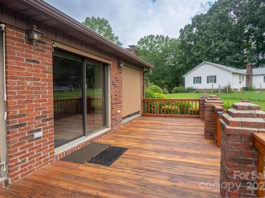 614 Azalea Lane, China Grove, NC 28023.  MLS# CAR4280599, YatesRealty ID 25550. Rear wooden deck.