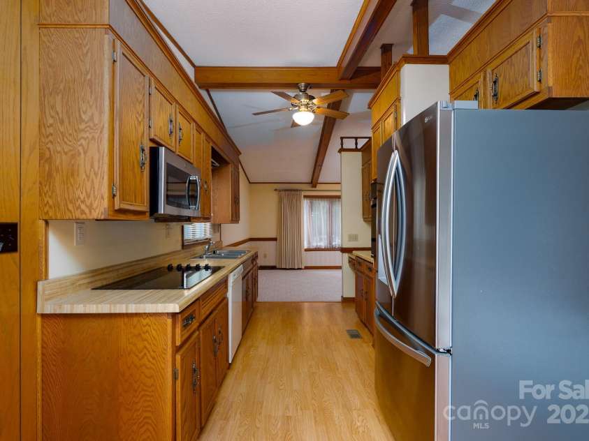 614 Azalea Lane, China Grove, NC 28023.  MLS# CAR4280599, YatesRealty ID 25550. View from breakfast area looking through kitchen to the dining room.