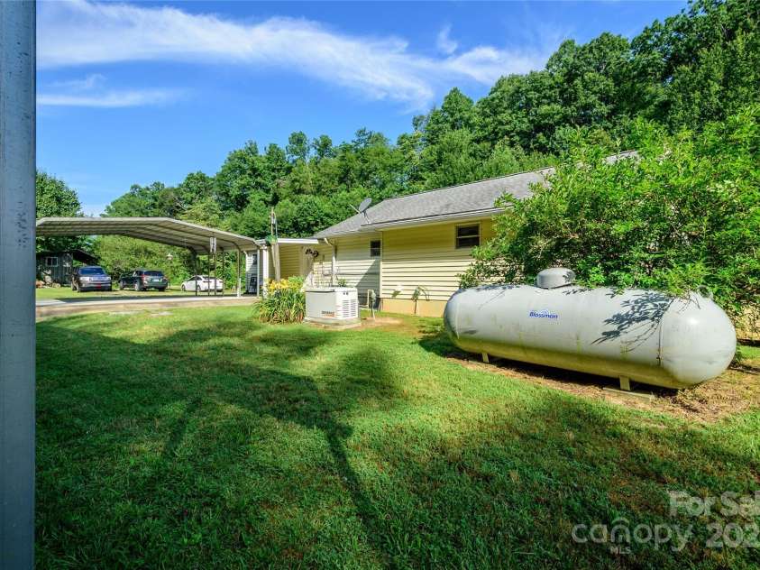 4720 Brevard Road, Horse Shoe, NC 28742.  MLS# CAR4278026, YatesRealty ID 25552. Back of home