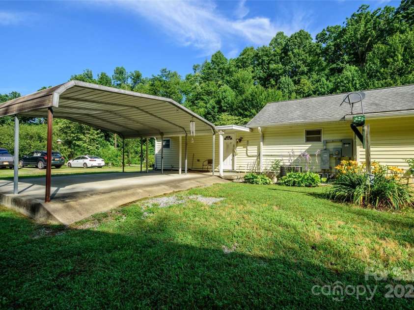 4720 Brevard Road, Horse Shoe, NC 28742.  MLS# CAR4278026, YatesRealty ID 25552. Back of Home