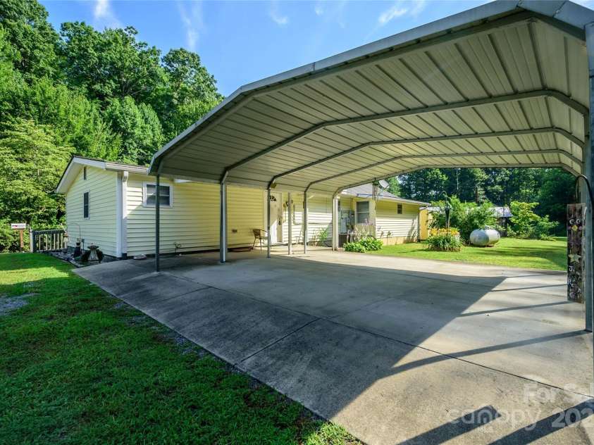 4720 Brevard Road, Horse Shoe, NC 28742.  MLS# CAR4278026, YatesRealty ID 25552. Carport