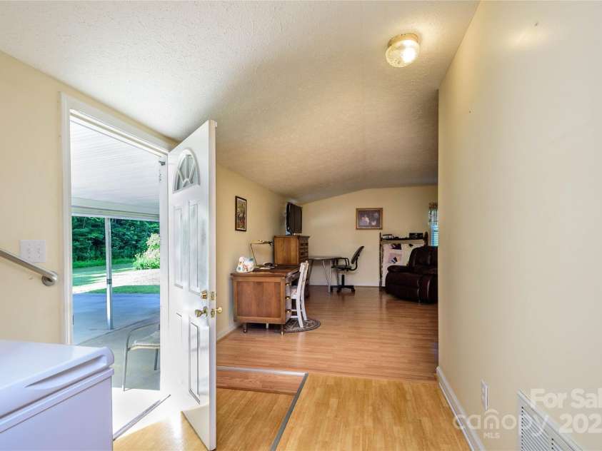 4720 Brevard Road, Horse Shoe, NC 28742.  MLS# CAR4278026, YatesRealty ID 25552. Entrance from back of home