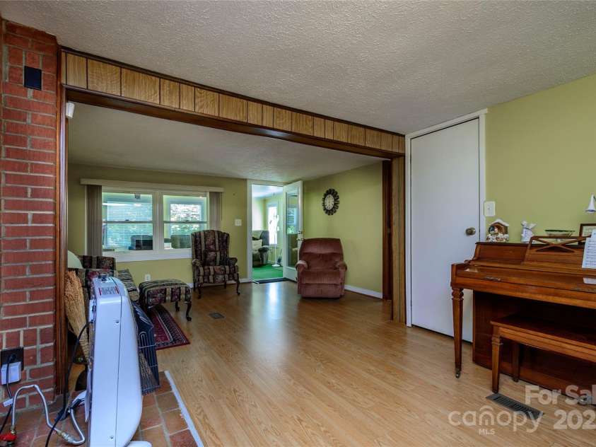 4720 Brevard Road, Horse Shoe, NC 28742.  MLS# CAR4278026, YatesRealty ID 25552. Family room
