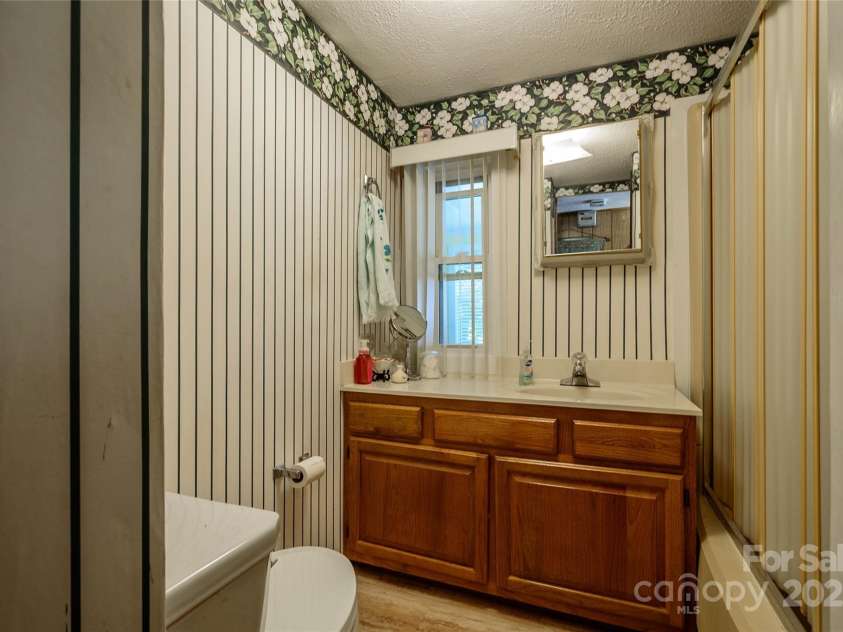 4720 Brevard Road, Horse Shoe, NC 28742.  MLS# CAR4278026, YatesRealty ID 25552. Guest Bathroom