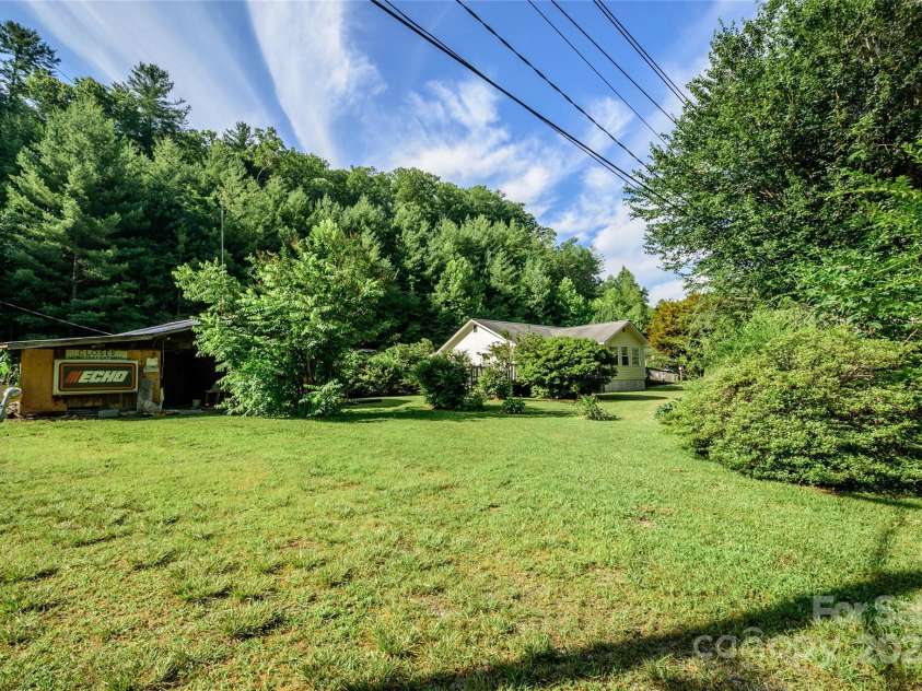 4720 Brevard Road, Horse Shoe, NC 28742.  MLS# CAR4278026, YatesRealty ID 25552. Large back yard