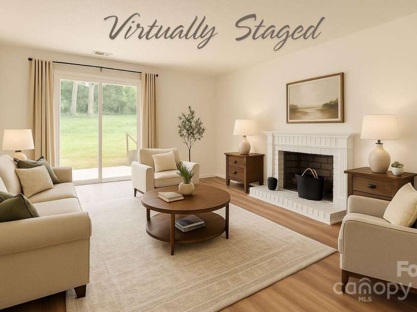 6221 Round Hill Road, Charlotte, NC 28211.  MLS# CAR4264179, YatesRealty ID 25553. Family room with wood burning fireplace &
