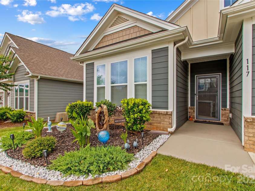 117 Cup Chase Drive, Mooresville, NC 28115.  MLS# CAR4279101, YatesRealty ID 25558. Attractive front garden and covered porch