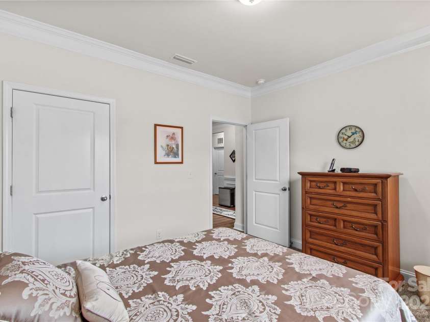 117 Cup Chase Drive, Mooresville, NC 28115.  MLS# CAR4279101, YatesRealty ID 25558. Bedroom 2 with crown molding.